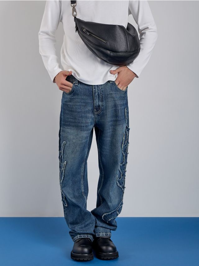 BAGGY JEANS WITH RAW-EDGE PATTERN